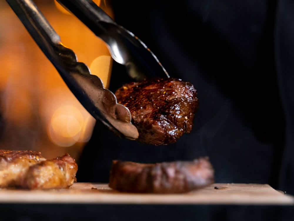 Mother's Day in Riyadh: piece of cooked steak in tongs